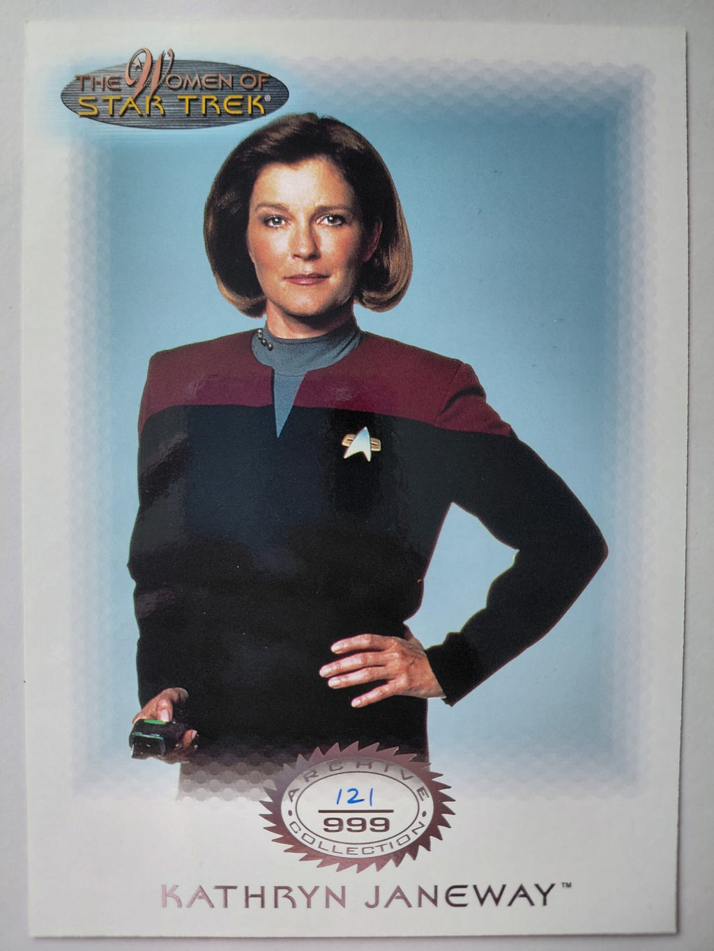 Trading card of Kathryn Janeway from 'Star Trek' with a blue background