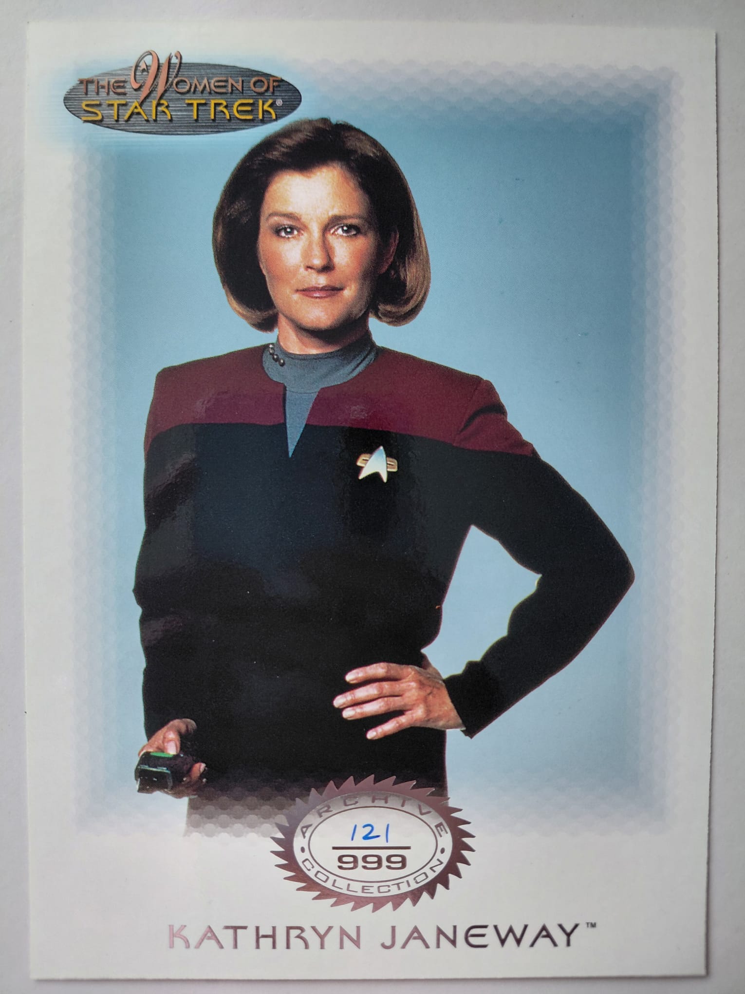Trading card of Kathryn Janeway from 'Star Trek' with a blue background