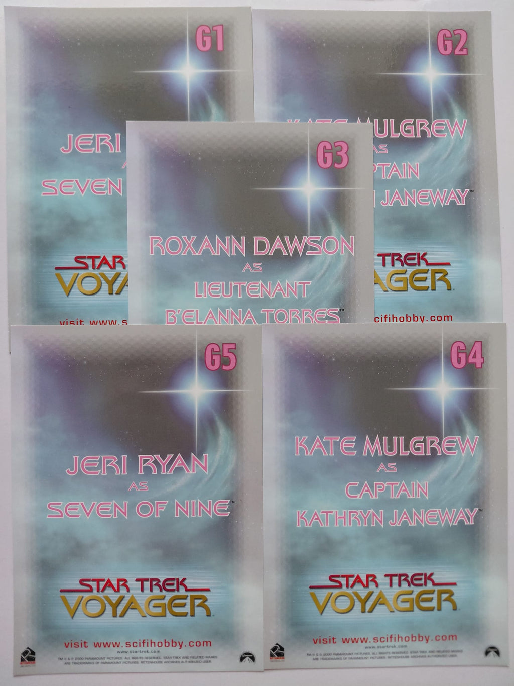 Star Trek Voyager trading card pack with character names and roles on a gradient background